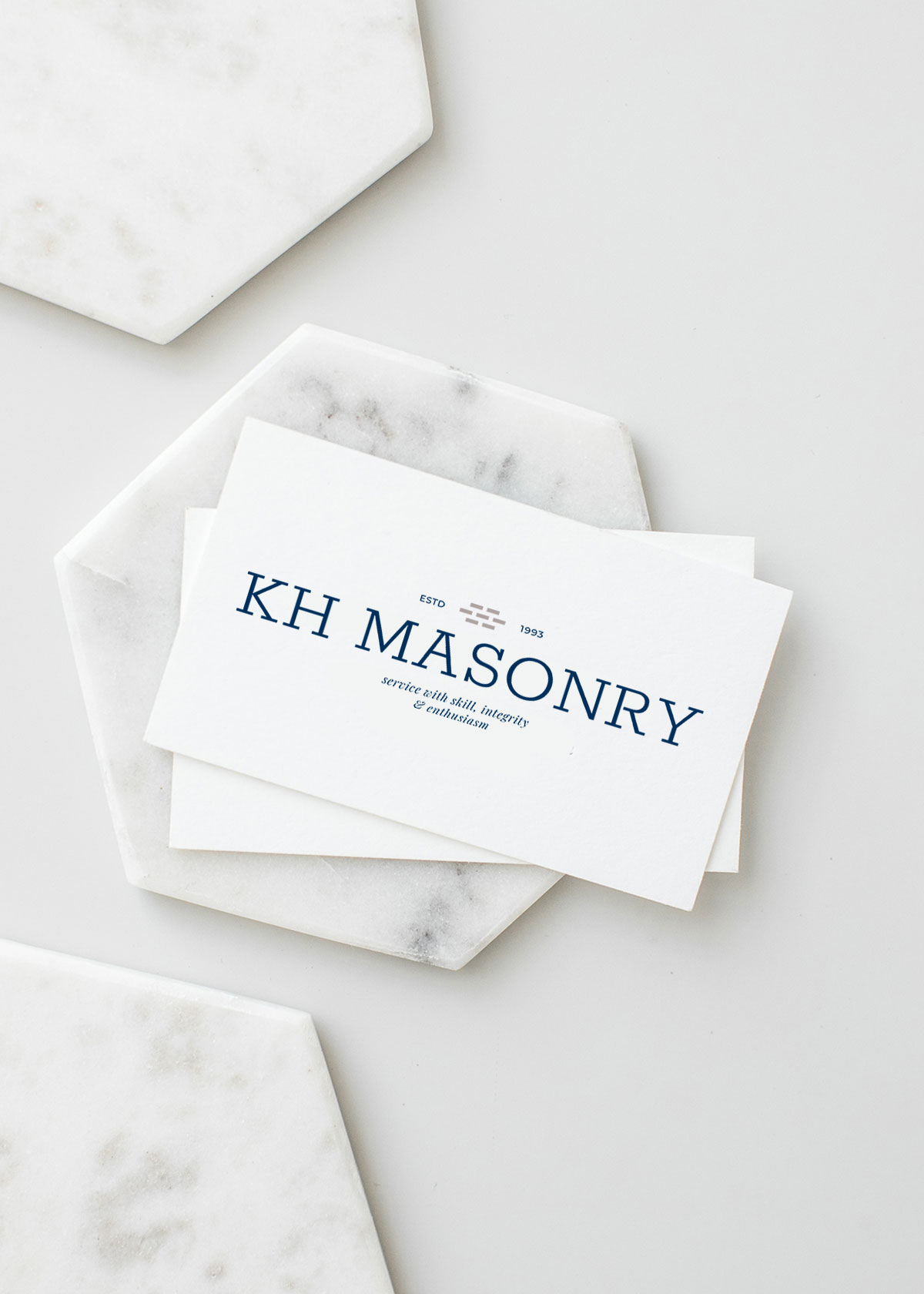 KH Masonry business card mockup with new wordmark logo design