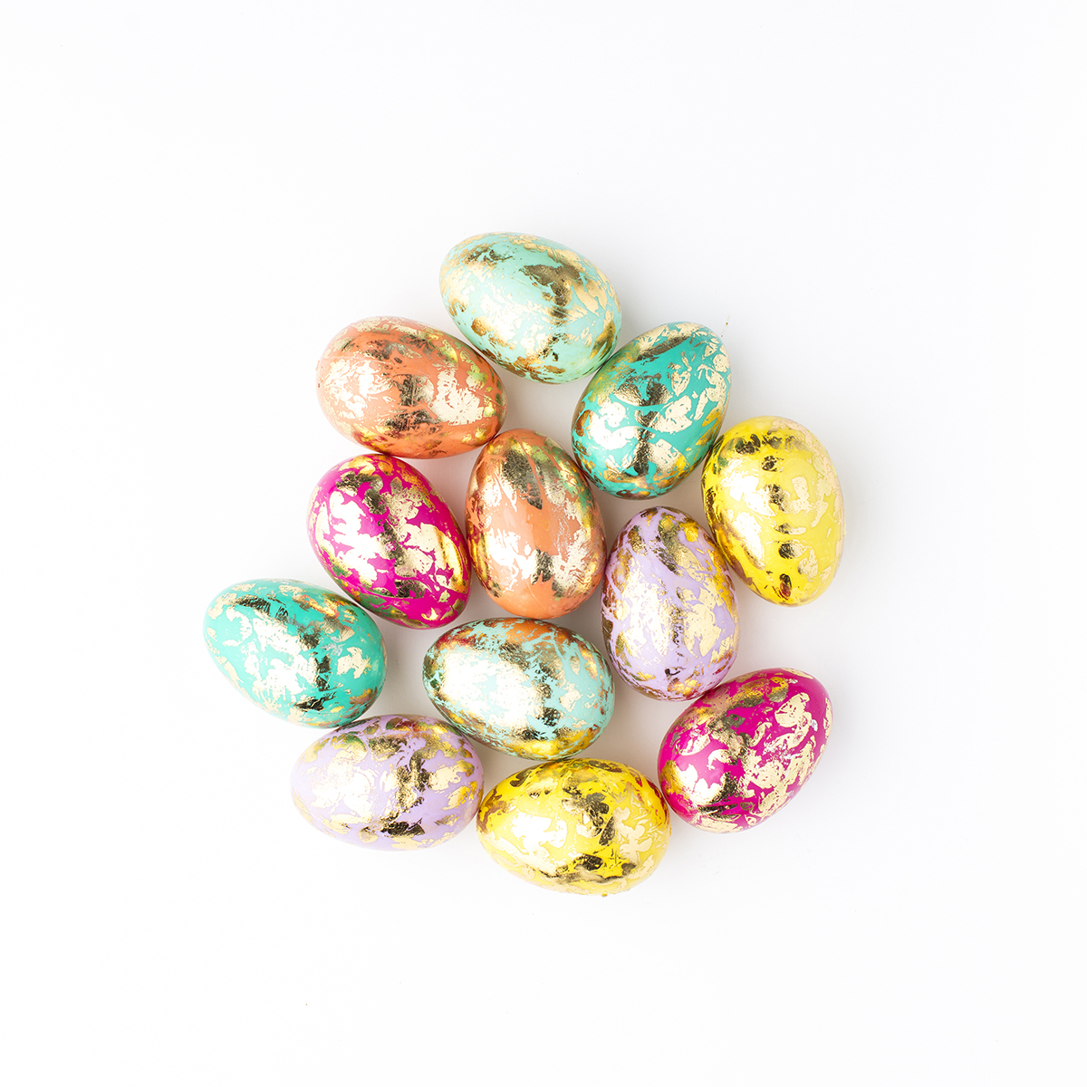 Brightly colored, foil-covered Easter eggs arranged in a cluster, symbolizing hidden surprises and fun, perfect for an Easter Egg website launch strategy.