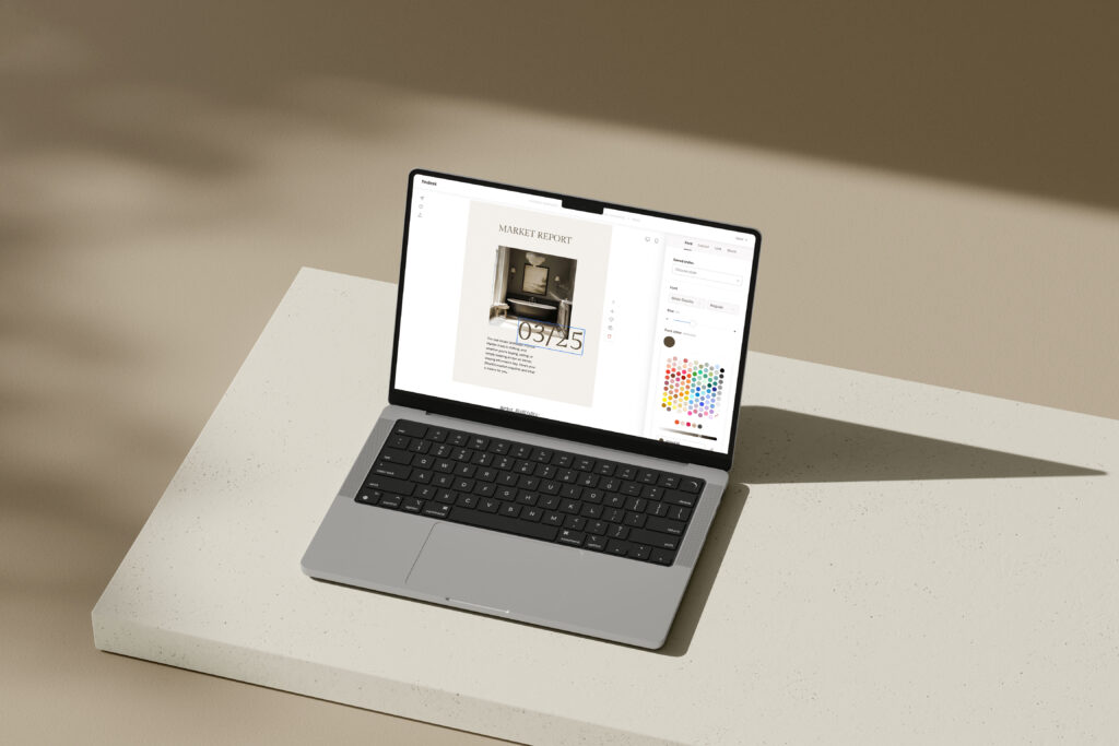 A laptop showing Flodesk open with a real estate email template being customized